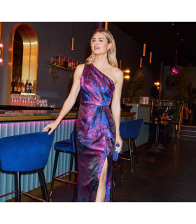 One-shoulder dress with draped details.