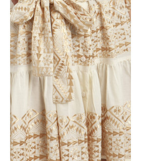 Dress with geometric embroidery in soft golden tones