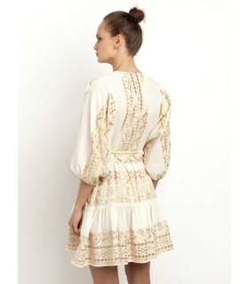 Dress with geometric embroidery in soft golden tones