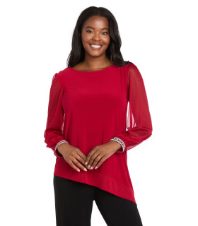 Asymmetrical blouse with long sleeves and shiny cuffs.