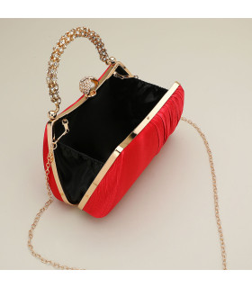 Bolso de mano con asa y cierre de perla adornado con diamantes