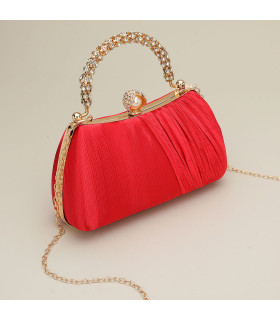 Bolso de mano con asa y cierre de perla adornado con diamantes