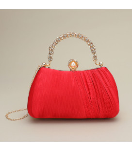 Bolso de mano con asa y cierre de perla adornado con diamantes