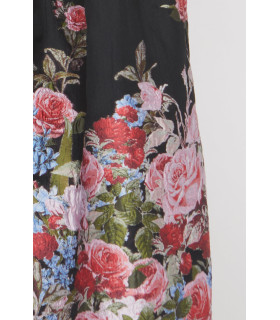 Long-sleeved dress with off-the-shoulder design and floral print at the bottom.