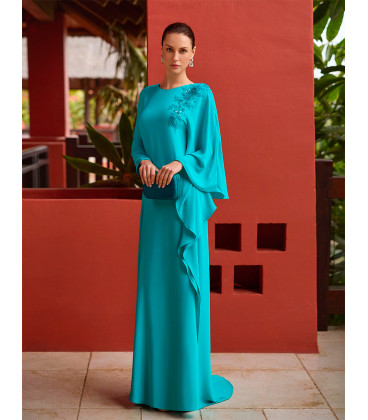 Cyan crepe dress with flowing sleeves and rhinestones.