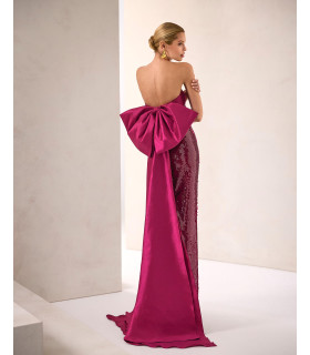 Strapless dress with sequined skirt and bow at the back