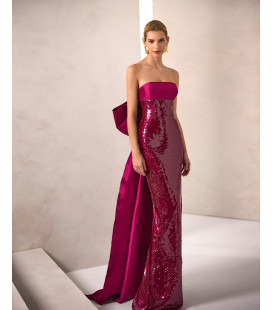 Strapless dress with sequined skirt and bow at the back
