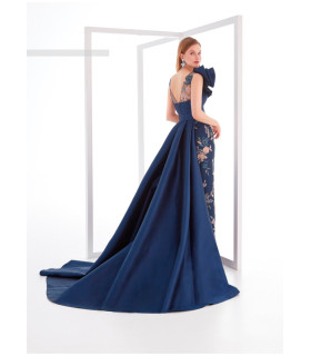 Piqué dress with rhinestones on the skirt and a large side ruffle.