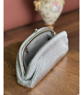Striped clutch bag with a classic metal closure