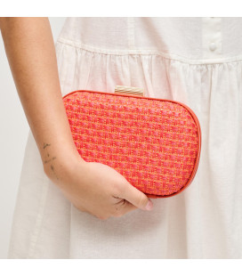 Woven bag with sculpted metal clasp
