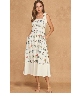Dress with floral embroidery and bows on the shoulders