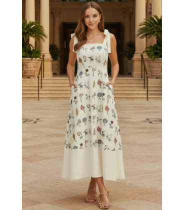 Dress with floral embroidery and bows on the shoulders