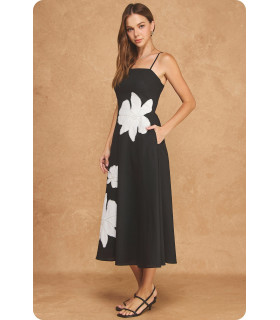 Dress with floral appliqués and open back
